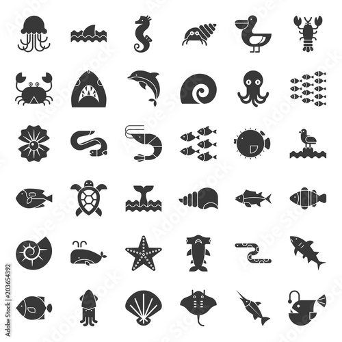 Aquatic Ocean life such as octopus  shell  pelican herd of fish  solid icon set
