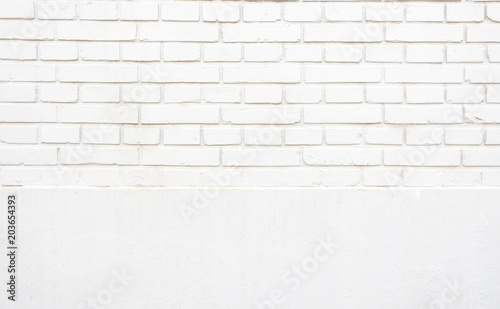 Grunge white two section brick wall texture background outdoor wall.