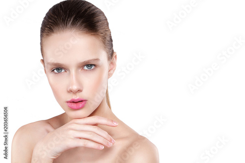 beauty of a woman's face. Natural makeup, pink lips, clean skin. Isolated white background.