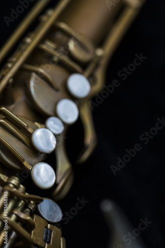 Vintage saxophone on a black background