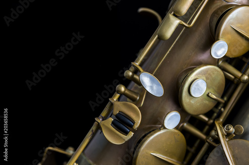 Vintage saxophone on a black background