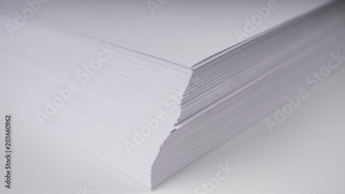 Stacks of white plain paper on white background © SergeVo