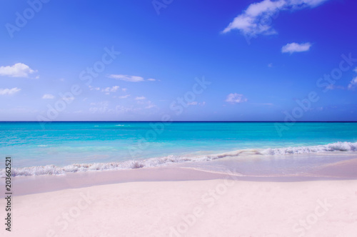 A deserted beach with white sand of the island of Saone. A view of the horizon of the Caribbean Sea.