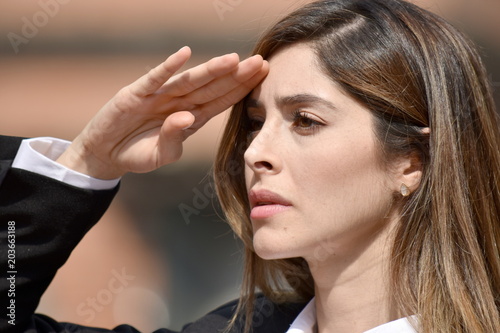 Business Woman Saluting Wearing Suit