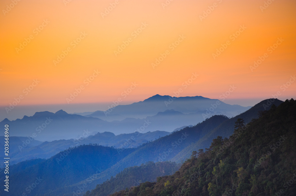 Beautiful mountains with shades of orange scenery in the early morning dawn.