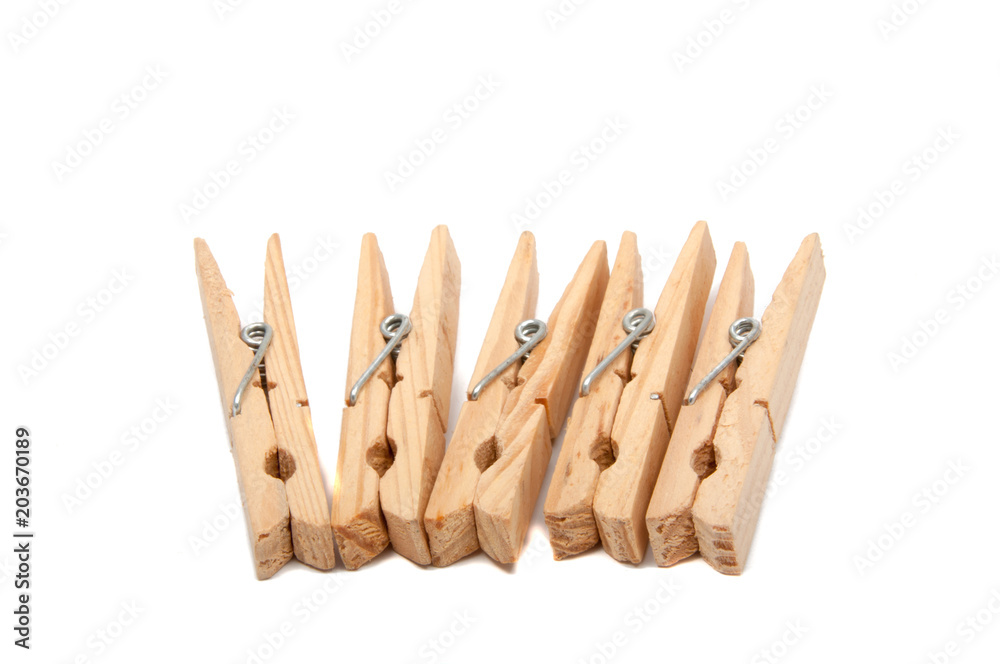wooden clothes pegs isolated on the white wooden clothes pegs isolated on the white