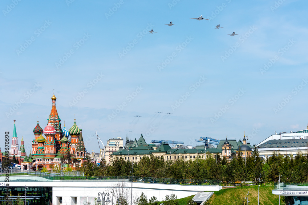 Moscow, Russia-may 4, 2018: a Group of Russian military aircraft in the sky at a rehearsal parade for Victory day. View of St. Basil's Cathedral from Zaryadye Park.