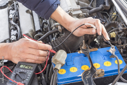 auto mechanic use digital multimeter check voltage battery and check fuse.