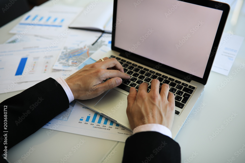 Young businessman's hands typing on the computer keyboard Young businessman's hands typing on the computer keyboard