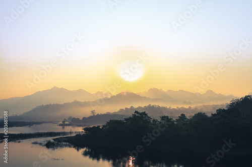 sunrise in the mountains landscape, Destination in thailand, Mountains with a calm river in the morning. © grapher_golf