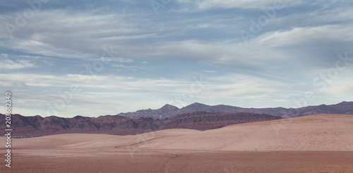 panoramic view death valley with some mountains on the back 