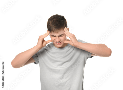 Stressed teenage boy on whi...