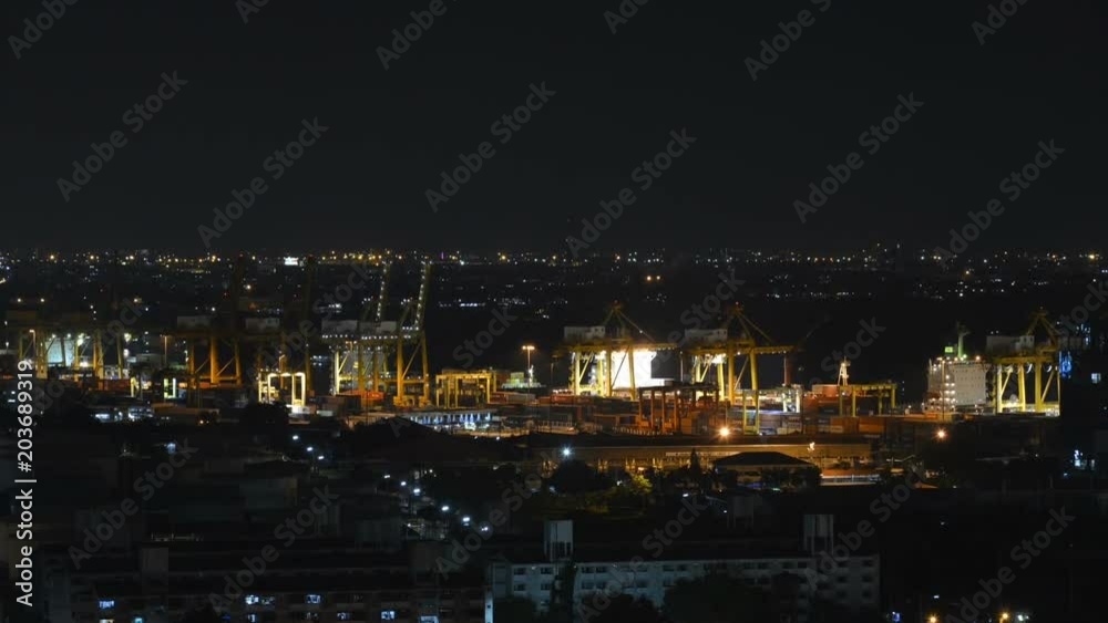Container Cargo freight ship with working crane loading bridge in shipyard at dusk for Logistic Import Export background