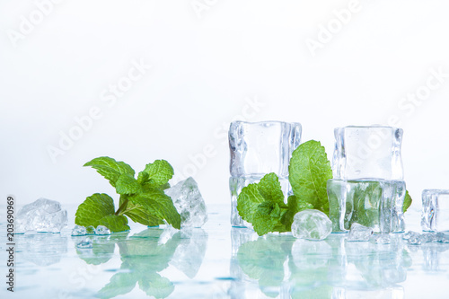 ice cubes and mint leaves isolated on a white background