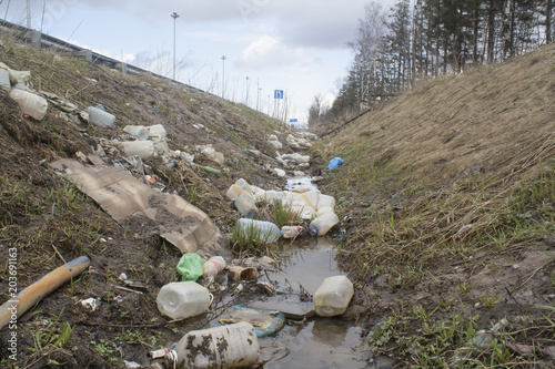 trash in a roadside ditch
