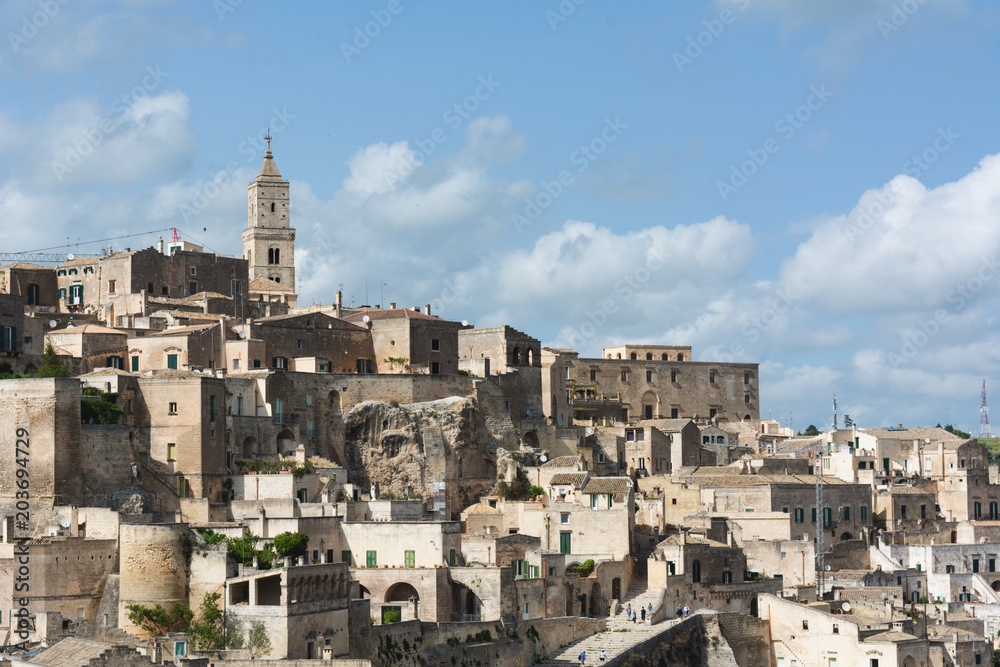 Horizontal View of the City of Matera and the Sassi on Blue Sky Background