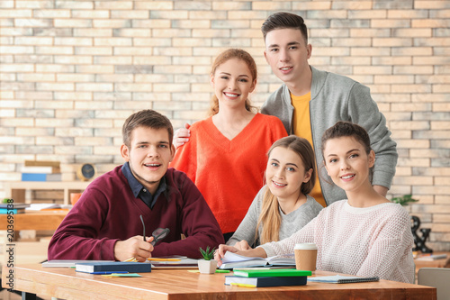 Group of teenagers studying...