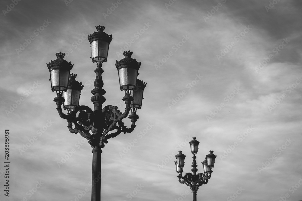 Popular ornate lamp posts over cloudy sky background in Bilbao city, north Spain