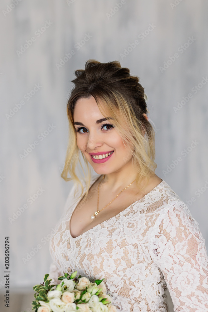 Beautiful woman in wedding dress in photo studio. Beautiful woman in wedding dress in photo studio.