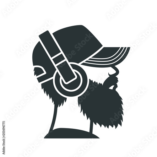 Bearded man in a cap and headphones