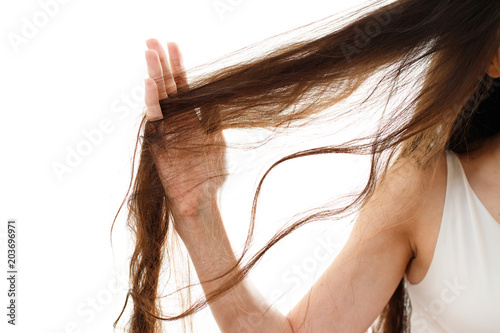 Young woman with problem hair. White background