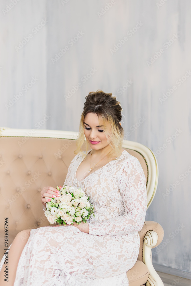 Beautiful woman in wedding dress in photo studio. Beautiful woman in wedding dress in photo studio.