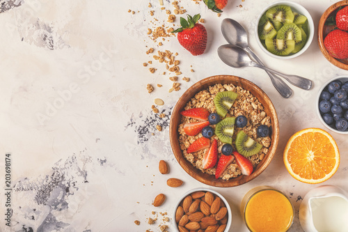 Healthy breakfast - bowl of muesli, berries and fruit