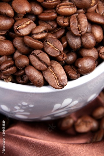 roasted coffee beans in a cup