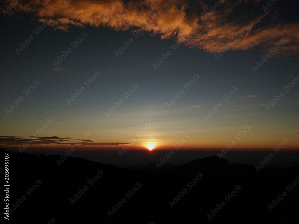 Landscape of Sunrise on top of mountain with view into misty valley.Foggy mountain in Chiangmai province,Thailand
