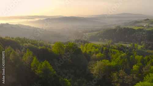 Beautiful sunrise in hills and countryside in lesser Poland,Drone fly backwards.