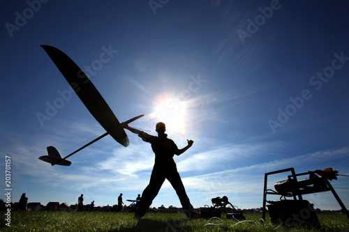 Man launches into the sky RC glider, wide-angle. F3J Model Gliders. Professional player and a competitor.