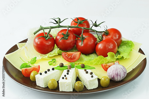 Tomatoes, cheese, with olives and lettuce
