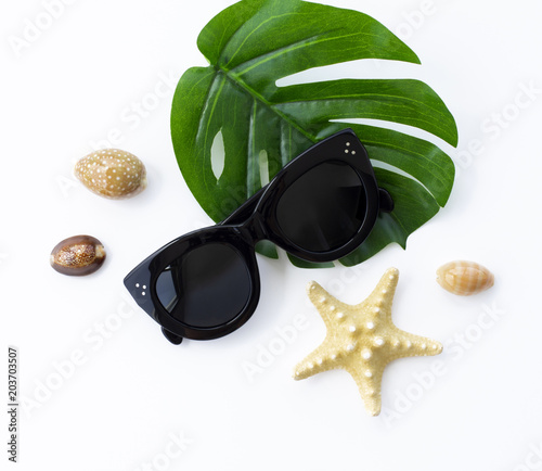 Flatlay beach accessories on white background. photo