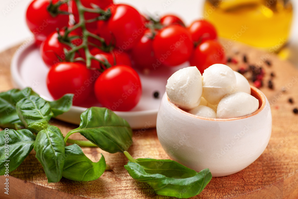 Tomatoes, basil, mozzarella cheese. Caprese salad ingredients