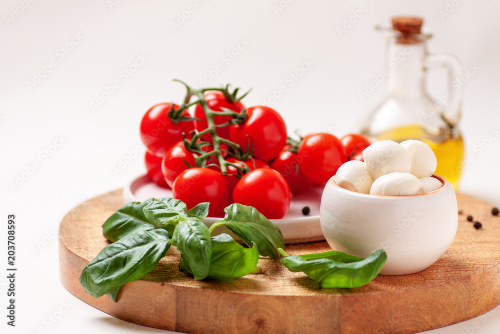 Tomatoes, basil, mozzarella cheese. Caprese salad ingredients