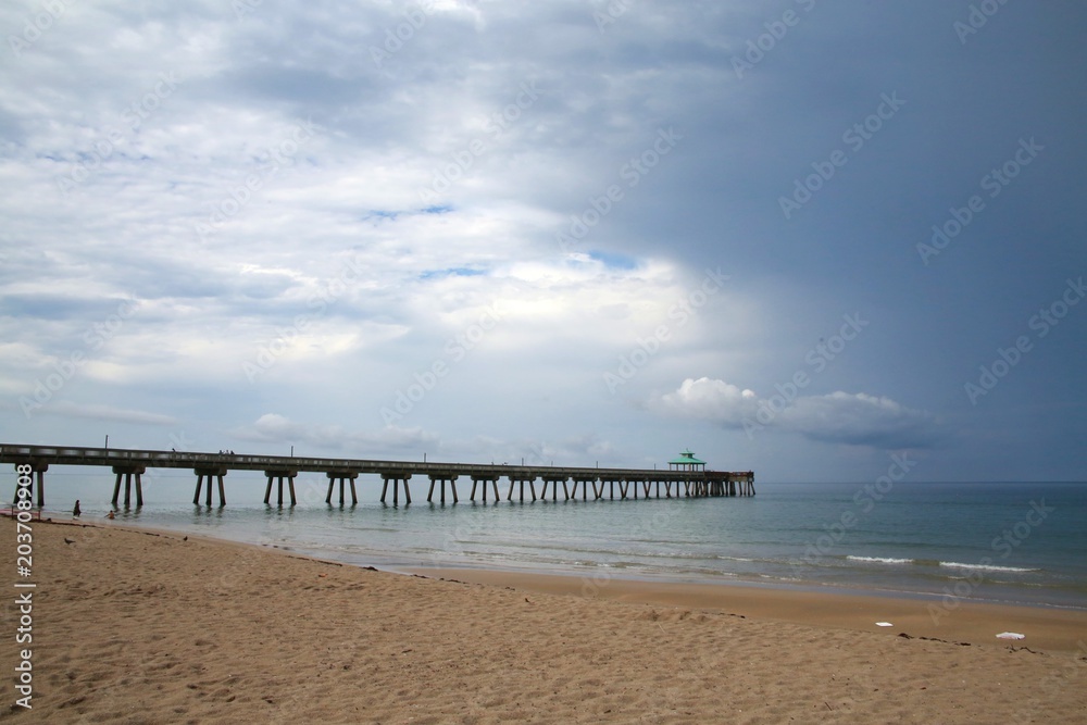 South Side of Deerfield Beach, Florida Pier under Dark Ominious Foreboding Storm Clouds in June