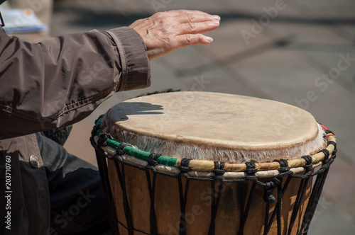 closeup of woman hand on african drums in outdoor