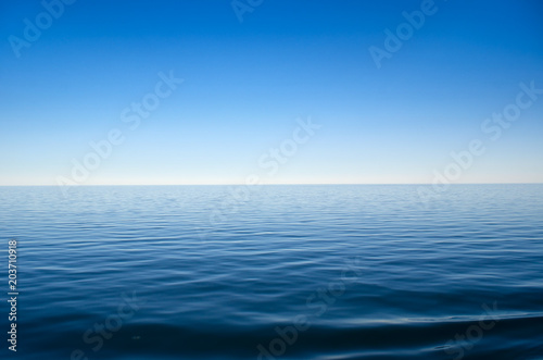 Panorama of sea waves against the blue sky © Oleksandrum