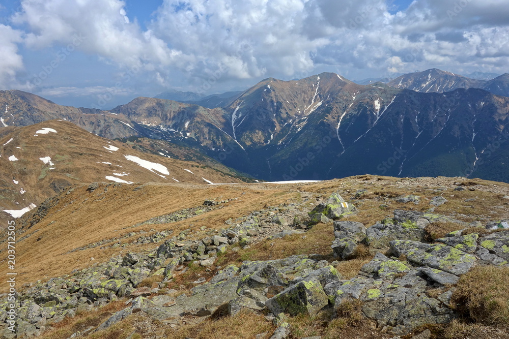 Fototapeta premium Mountain landscape High Tatras National Park, Žiarska dolina, Slovakia, Europe. Tourists walk in the mountains. Active holiday concept