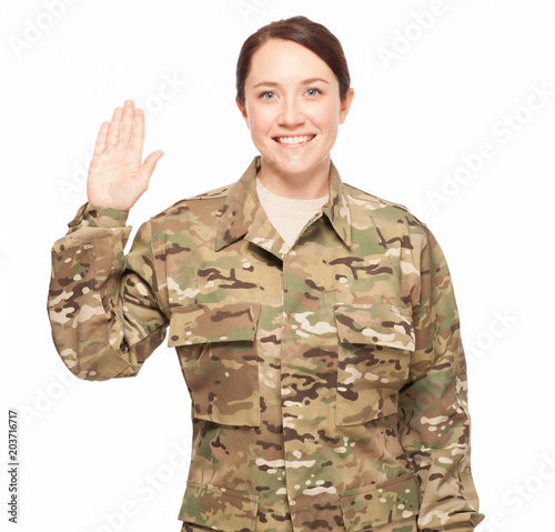 Oath of enlistment for female soldier smiling.
