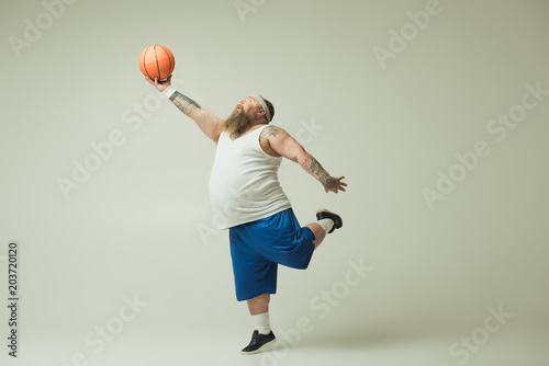 Man holding basketball © Yakobchuk Olena