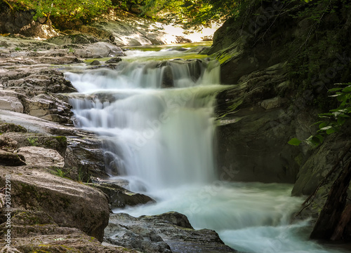 Fototapeta Naklejka Na Ścianę i Meble -  waterfall with long exposure and rocky mountain
