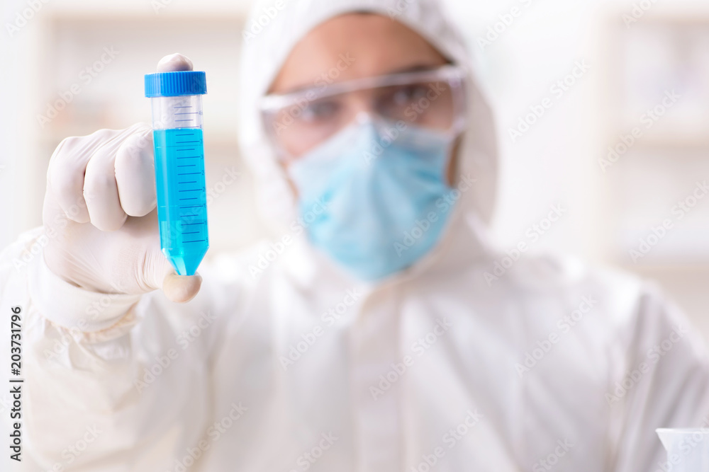 Young chemist student working in lab on chemicals Young chemist student working in lab on chemicals