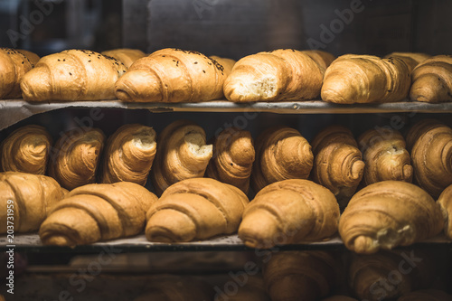 A lot of fresh homemade croissants Sold in a small bakery
