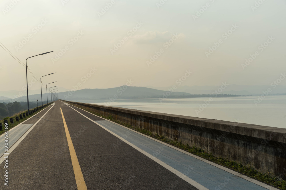 Fototapeta premium Run Exercise Road on dam Mountain View