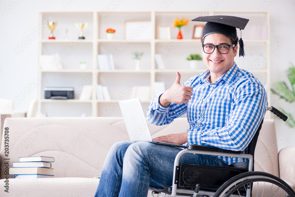 Young student on wheelchair in disability concept Young student on wheelchair in disability concept