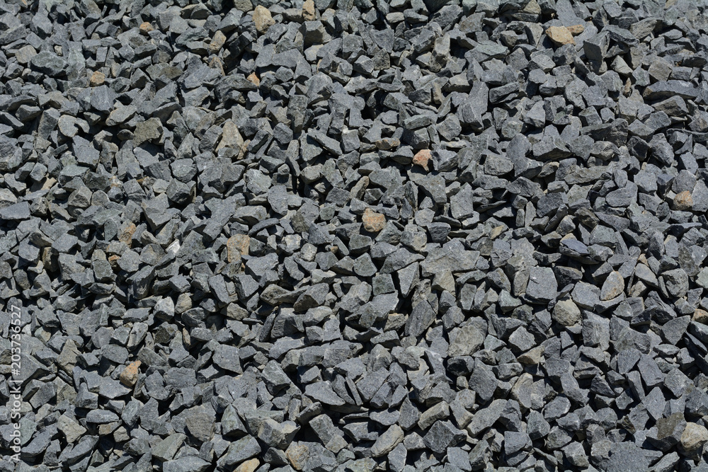 Close up of crushed rock pile used in road paving and construction Close up of crushed rock pile used in road paving and construction