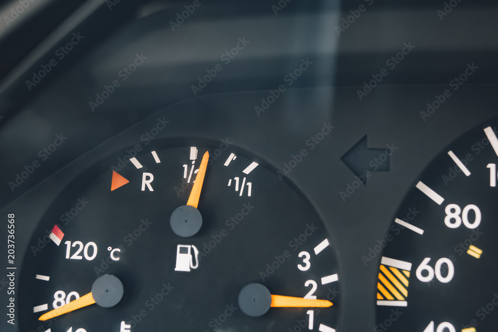 Fototapeta premium The instrument panel of the car. Red arrow. Close up