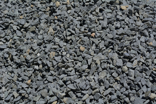 Close up of crushed rock pile used in road paving and construction 