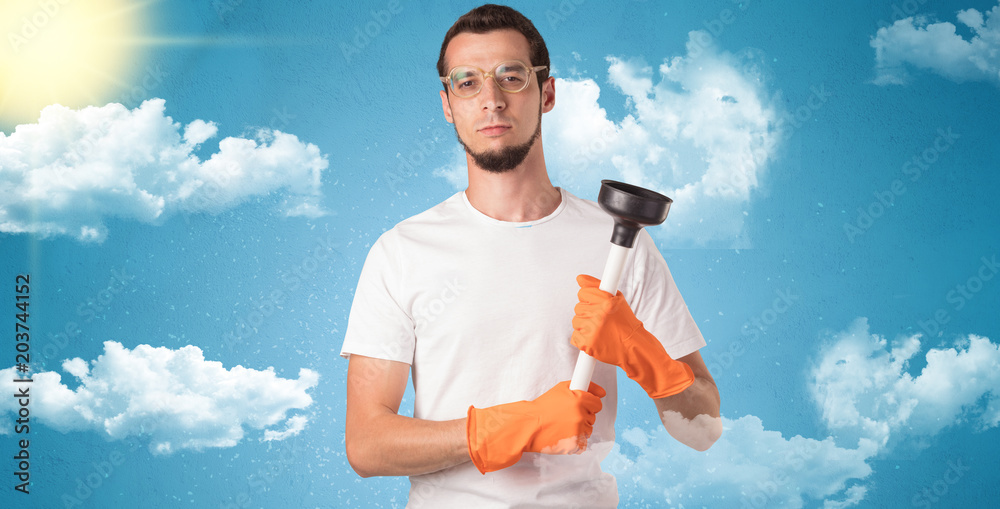 Sunny and cloudy concept with male housekeeper and orange gloves on his hand
Sunny and cloudy concept with male housekeeper and orange gloves on his hand